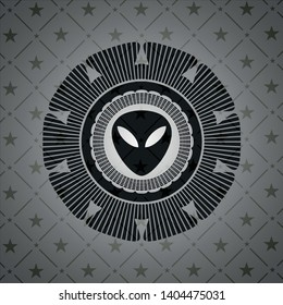 alien icon inside dark badge or emblem