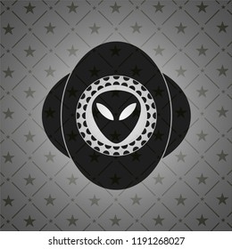alien icon inside dark emblem