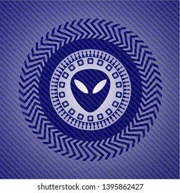 alien icon inside emblem with denim high quality background