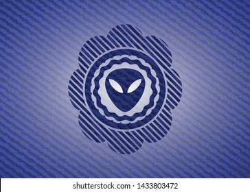 alien icon inside emblem with denim texture