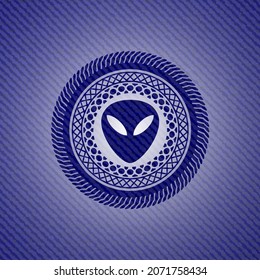 alien icon inside emblem with jean high quality background. 