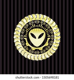 alien icon inside gold badge or emblem
