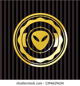 alien icon inside gold emblem