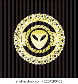 alien icon inside gold shiny emblem