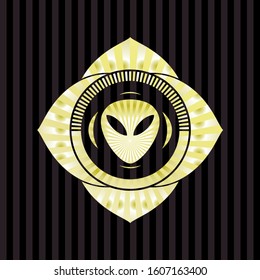 alien icon inside gold shiny emblem