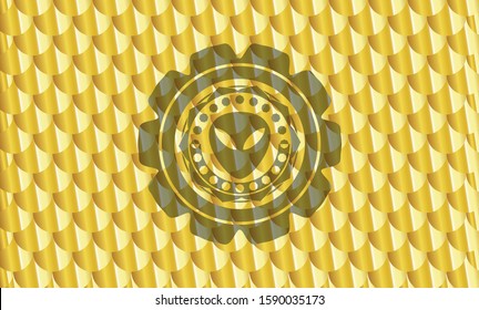 alien icon inside golden emblem or badge. Scales pattern. Vector Illustration. Detailed.