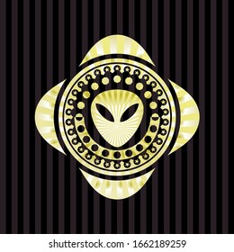 alien icon inside golden emblem or badge