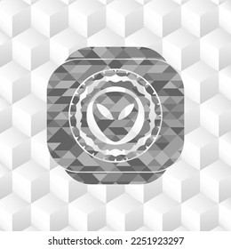 alien icon inside grey badge with geometric cube white background. 