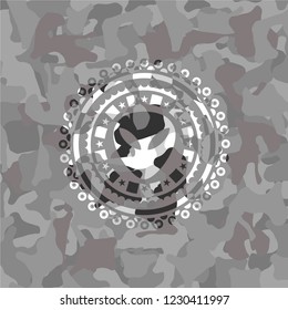 alien icon inside grey camo emblem