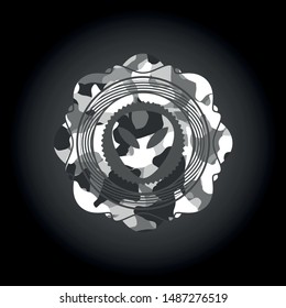 alien icon inside grey camouflage emblem