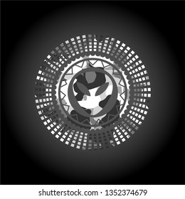 alien icon inside grey camouflaged emblem