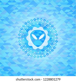 alien icon inside light blue emblem with triangle mosaic background