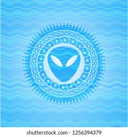 alien icon inside light blue water style badge.