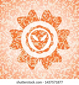 alien icon inside orange mosaic emblem