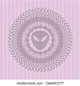 alien icon inside pink emblem