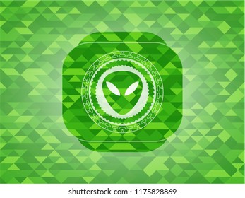 alien icon inside realistic green emblem. Mosaic background