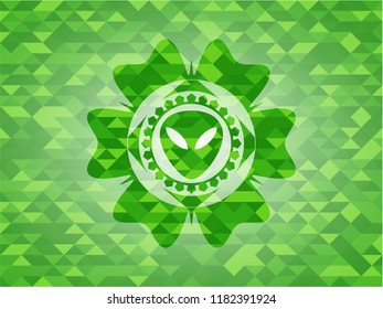 alien icon inside realistic green mosaic emblem