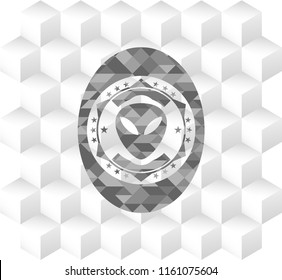 alien icon inside realistic grey emblem with geometric cube white background