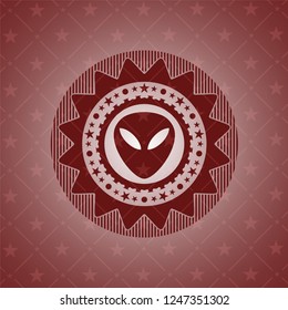 alien icon inside red emblem