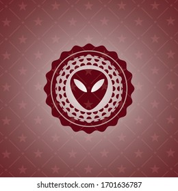 alien icon inside red emblem