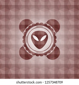 alien icon inside red seamless geometric badge.