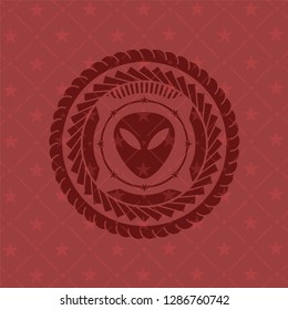 alien icon inside retro red emblem