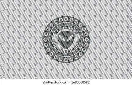 alien icon inside shiny silver emblem. Scales pattern. Vector Illustration. Detailed.