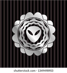 alien icon inside silver badge or emblem