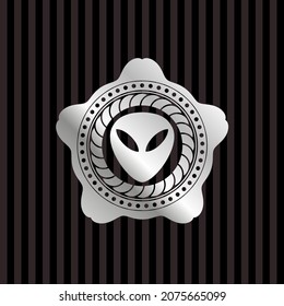 alien icon inside silver badge. 