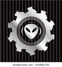 alien icon inside silver emblem or badge