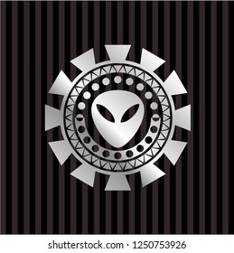 alien icon inside silver emblem