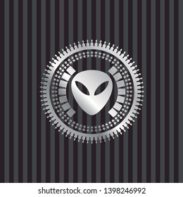 alien icon inside silver emblem