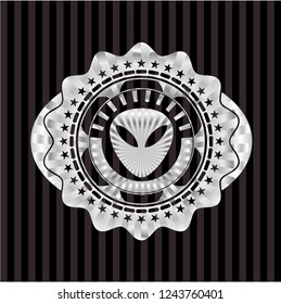 alien icon inside silvery badge or emblem