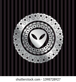 alien icon inside silvery badge or emblem