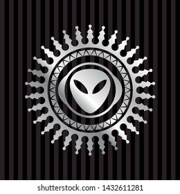alien icon inside silvery badge or emblem