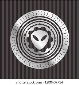 alien icon inside silvery emblem