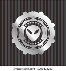 alien icon inside silvery emblem