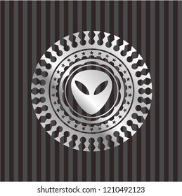 alien icon inside silvery emblem or badge