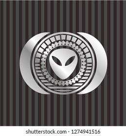 alien icon inside silvery emblem or badge