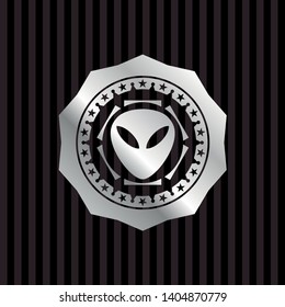alien icon inside silvery emblem