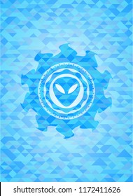 alien icon inside sky blue emblem with mosaic background