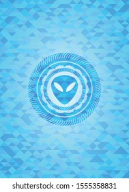 alien icon inside sky blue mosaic emblem