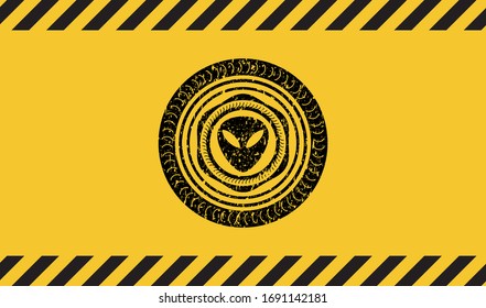 alien icon inside warning sign, black grunge emblem. Vector Illustration. Detailed.