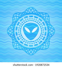 alien icon inside water emblem background. 