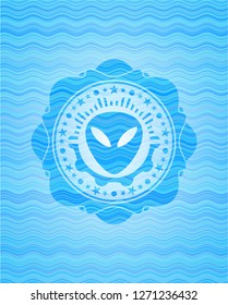 alien icon inside water wave style badge.