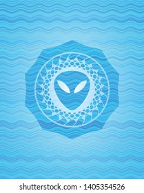 alien icon inside water wave style emblem.