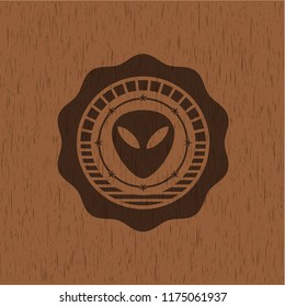 alien icon inside wood emblem. Vintage.