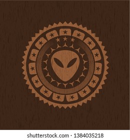 alien icon inside wood emblem