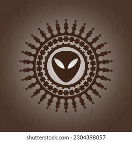 alien icon inside wooden emblem. Vintage. 