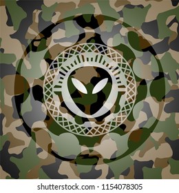 alien icon on camouflage texture